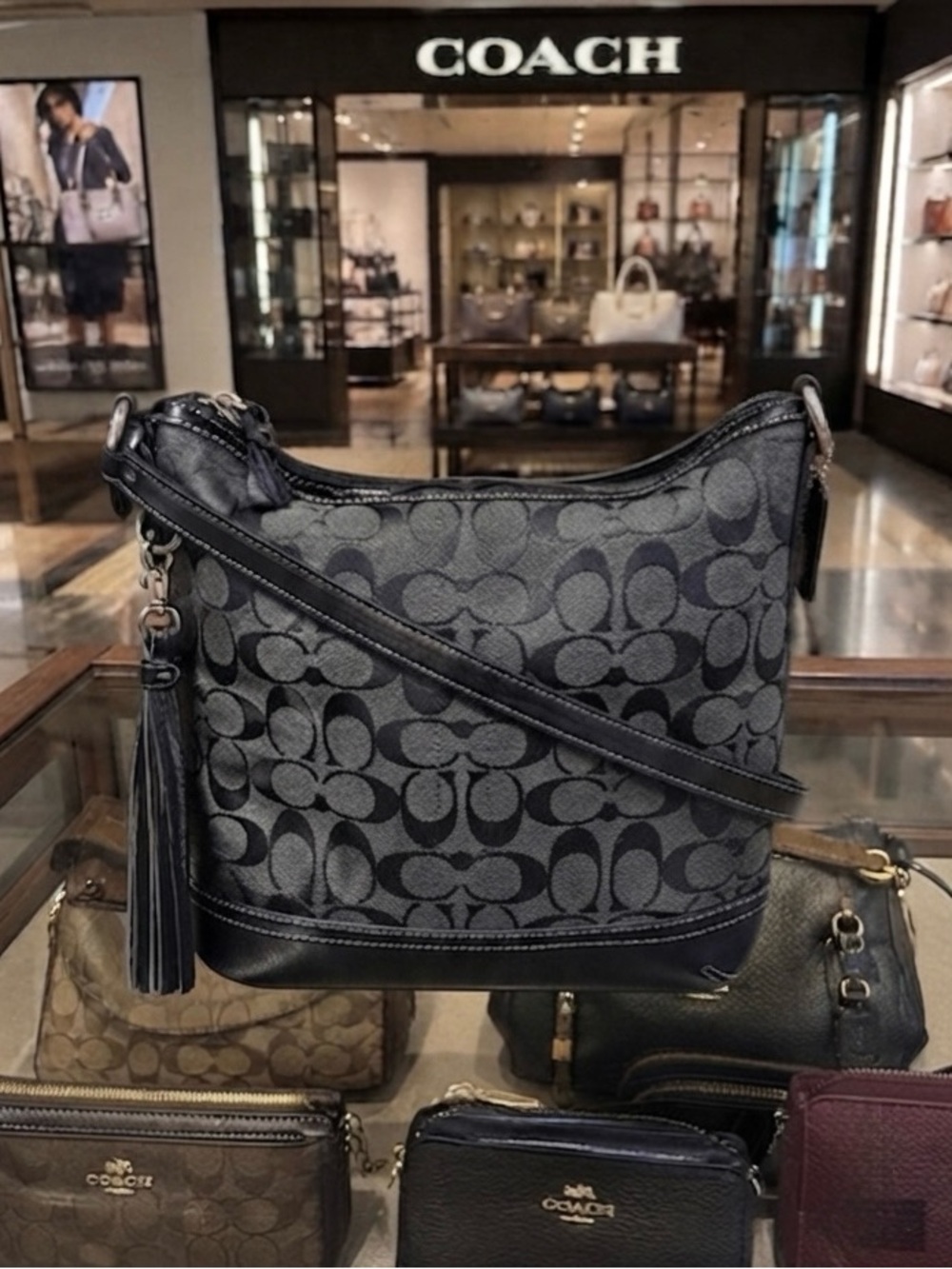 Coach EUC vintage Black Signature 
Jacquard shoulder bag w/
Tassel no call outs
